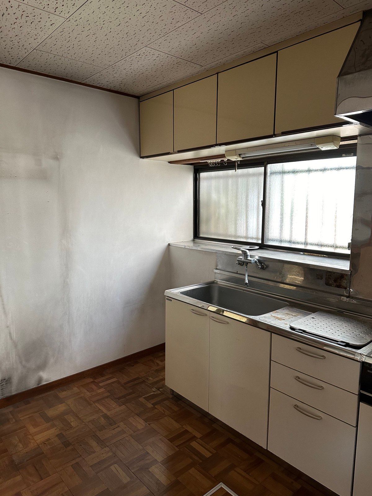 Original dated kitchen in abandoned akiya before restoration